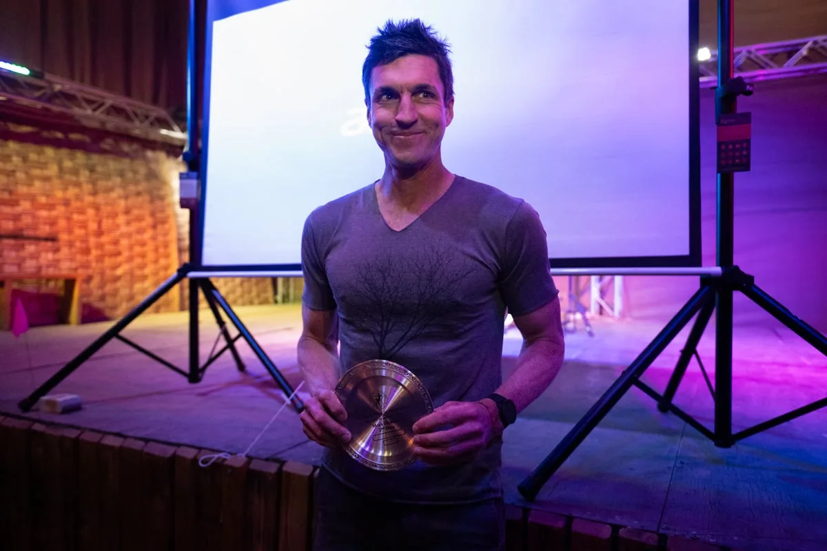 Jeremy Inabnit holding his 2nd place award from the Atacama Crossing