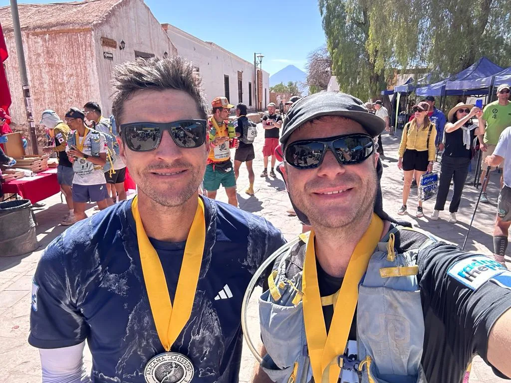 Jeremy Inabnit and a fellow finisher with their Atacama Crossing medals
